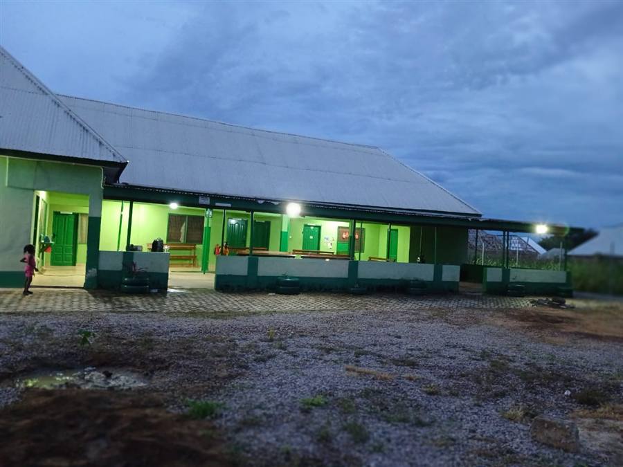 Menesto Medical Center facility building at dusk in Balungo, Bongo District